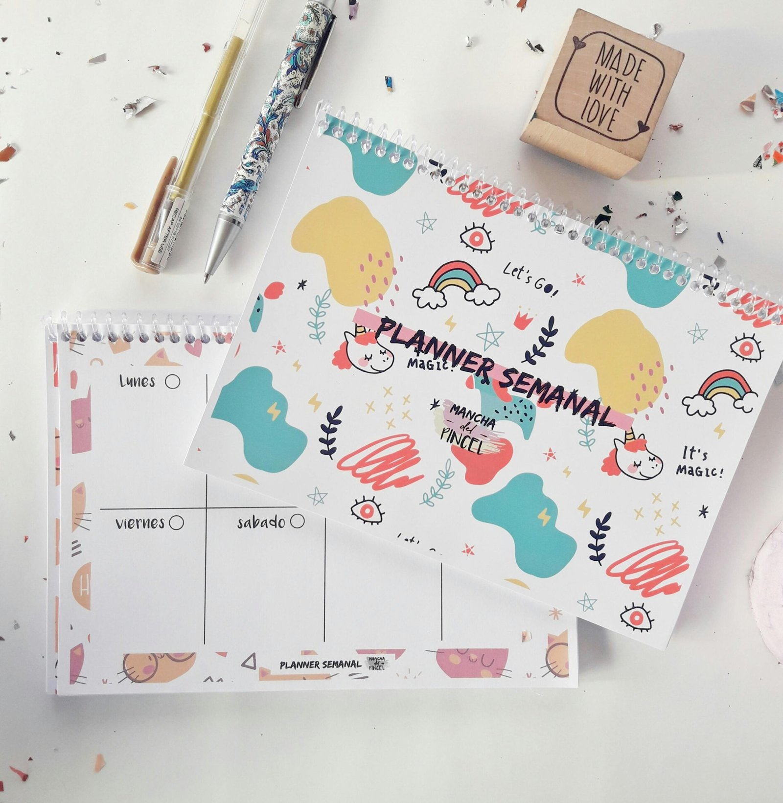 Colorful weekly planner with accessories and motivational designs.